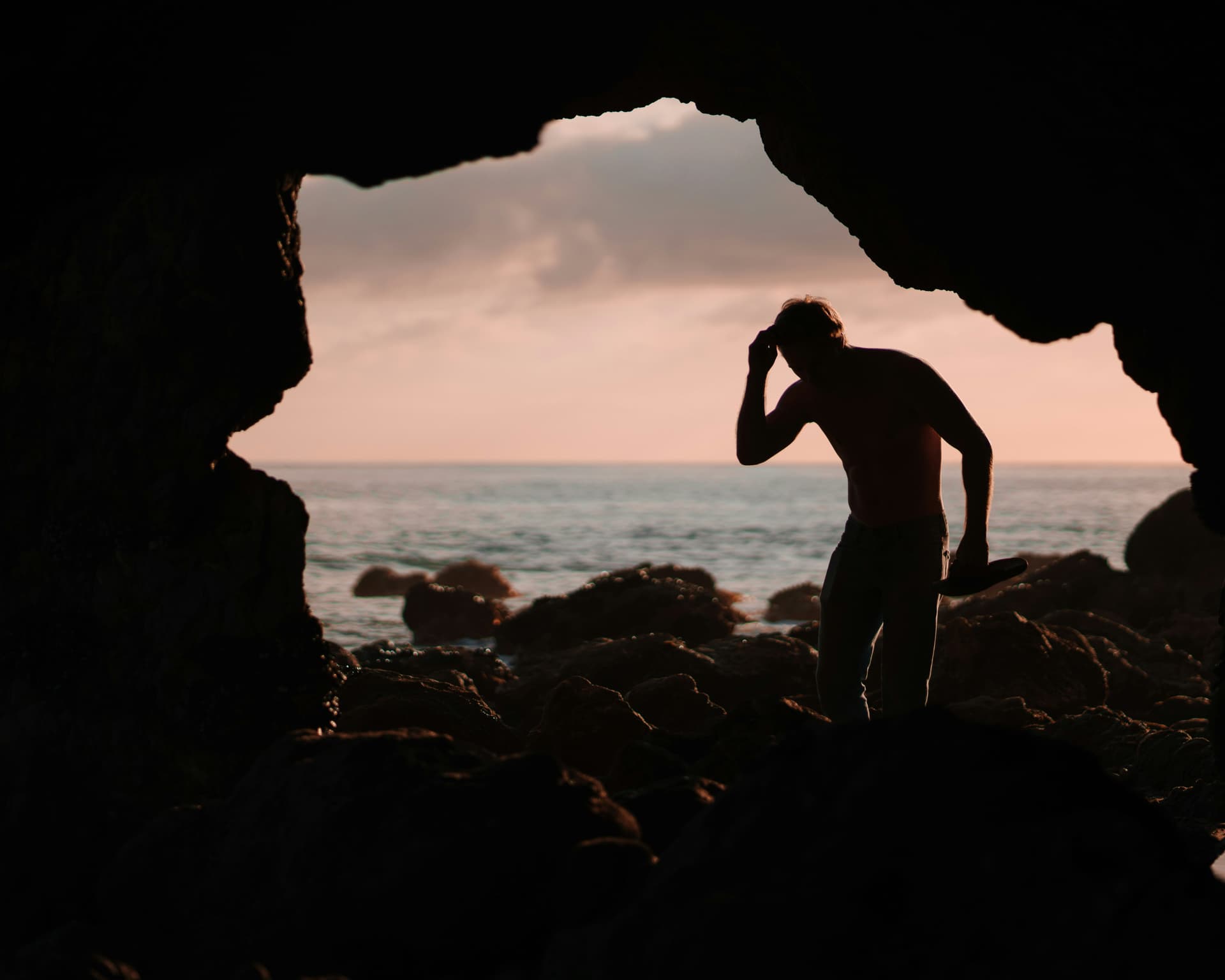 Man in cave that represents the caveman
